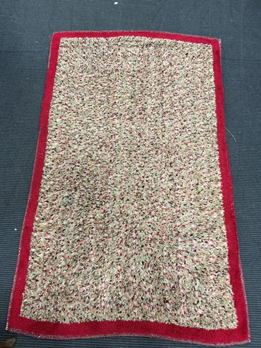 Lot 477 - A 20th century woollen rug with deep cut pile,...