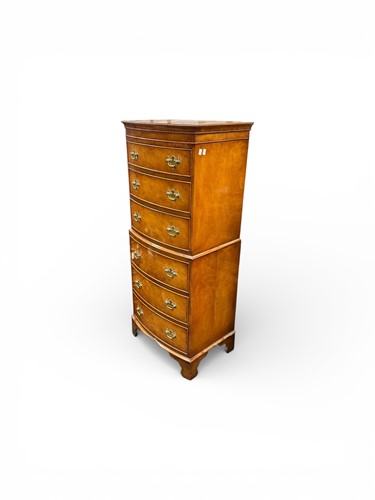 Lot 611 - A small and narrow bow fronted chest on chest...