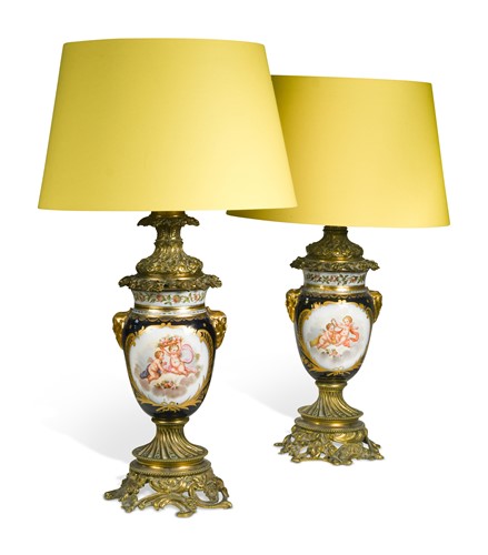 Lot 448 - A pair of French Sevres style gilt metal mounted table lamps, late 19th century