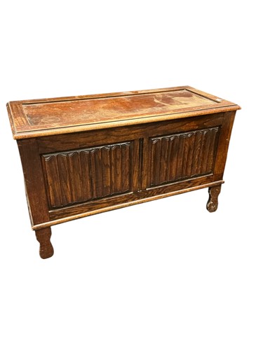 Lot 607 - A 20th century coffer with carved linen-fold...