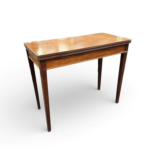 Lot 427 - A 19th century mahogany fold over tea table...