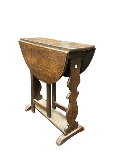 Lot 363 - A 19th century oak gate leg table with cut...