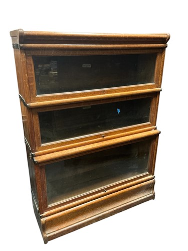 Lot 417 - A 20th century Globe Wernicke oak sectional...