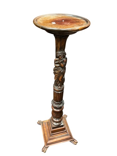 Lot 370 - A carved plant stand, composite support set on...