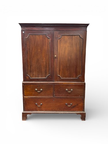Lot 424 - A mahogany linen press in original country...