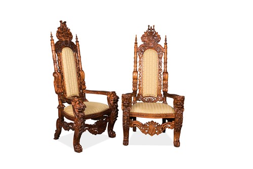 Lot 127 - A pair of large 'baronial' stained fruitwood elbow chairs, modern