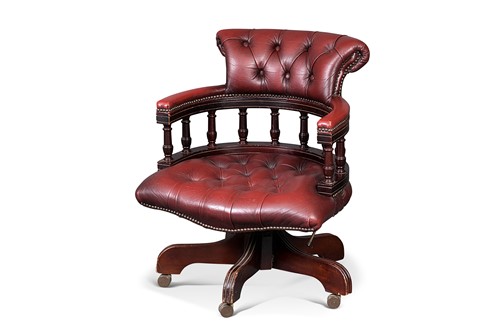 Lot 119 - A red leather upholstered swivel chair