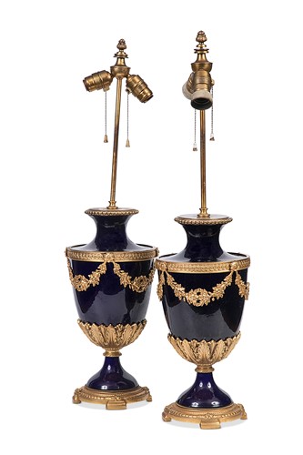 Lot 87 - A pair of Louis XVI style 'Sevres' porcelain and gilt metal mounted lamps