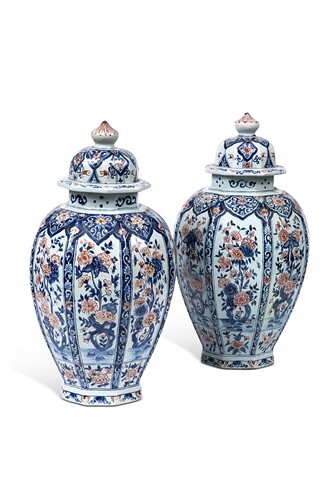 Lot 31 - A pair of Delft blue, white and iron red vases and covers, late 18th century