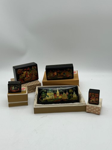 Lot 45 - Five Russian lacquer boxes painted with scenes...