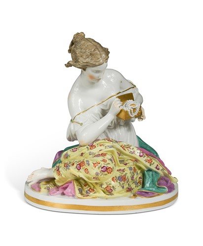 Lot 645 - A Meissen porcelain figure of a seated lady, circa 1900