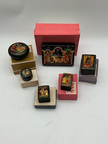 Lot 46 - Six Russian black lacquer boxes painted with...