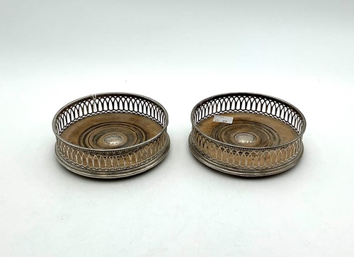 Lot 23 - A pair of modern pierced silver coasters