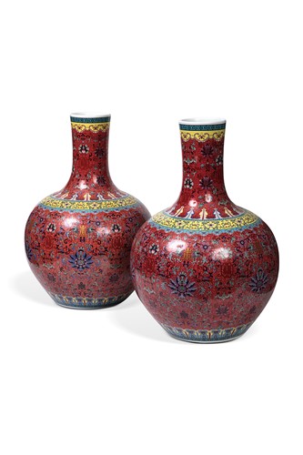 Lot 45 - A pair of large Chinese red ground bottle vases