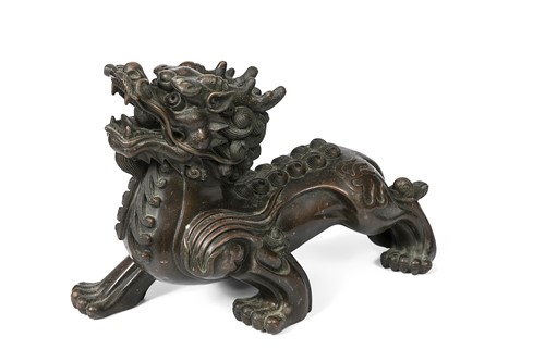 Lot 57 - A Chinese bronze model of a mythical creature or Pixiu