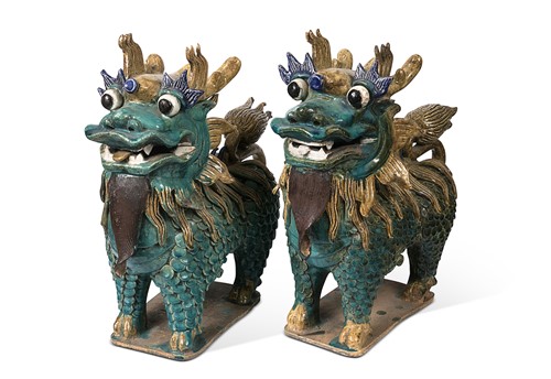 Lot 43 - A pair of Chinese pottery lions