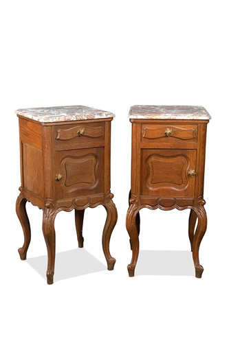Lot 151 - A pair of French marble topped bedside cabinets or chevets, 20th century