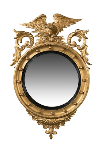 Lot 115 - A Regency convex gilt wall mirror