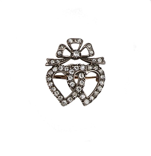 Lot 113 - A late Victorian diamond set double heart bow brooch