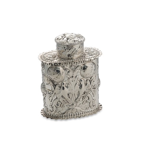 Lot 436 - A continental embossed silver caddy with cover