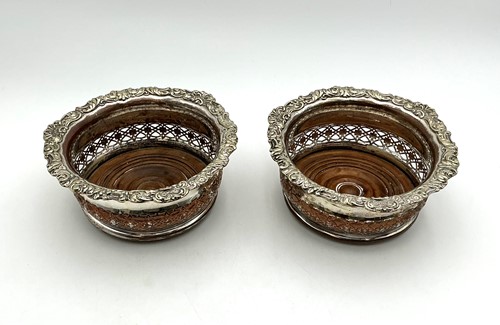 Lot 7 - A pair of large silver plated wine coasters