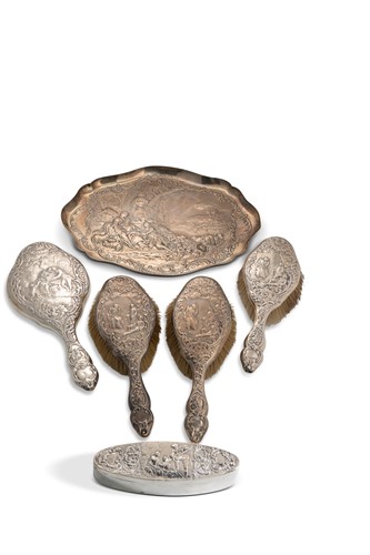 Lot 386 - A Edward VII hallmarked silver dressing table set