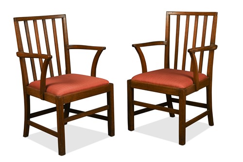 Lot 204 - Attributed to Edward Barnsley (1900-1987), a pair of Cotswold School oak elbow chairs
