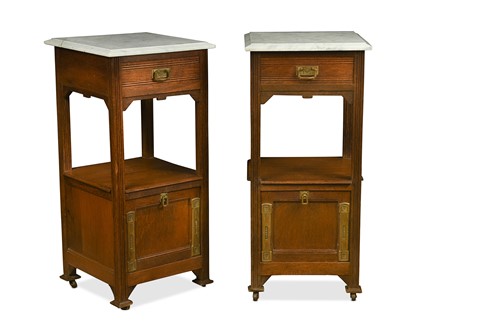 Lot 199 - A pair of Arts & Crafts marble-topped oak bedside tables
