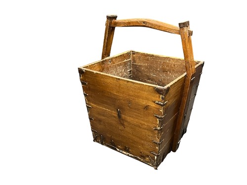 Lot 429 - A Chinese elm handled farmers bucket, late...