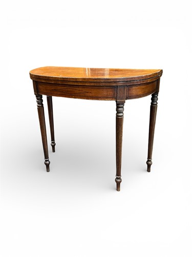 Lot 459 - A Regency mahogany card table with ebony line...
