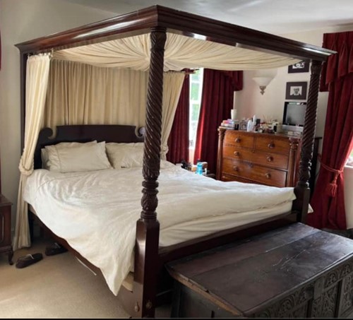 Lot 116 - A George III style mahogany four poster bed