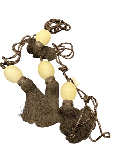 Lot 227 - Four ostrich egg brown corded curtain tie...