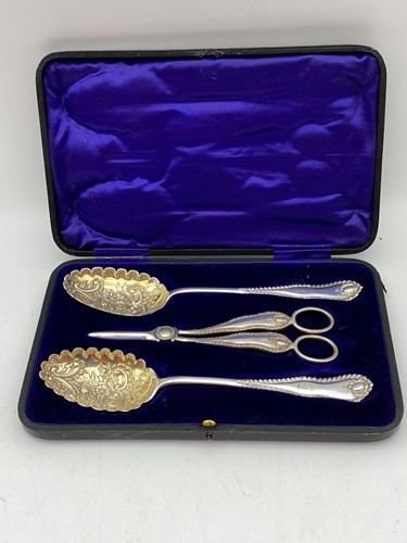 Lot 344 - A cased pair of silver plated berry spoons...