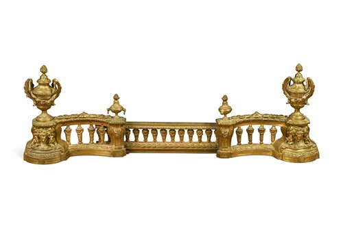 Lot 559 - A pair of French Louis XVI style gilt-metal chenets, 20th century