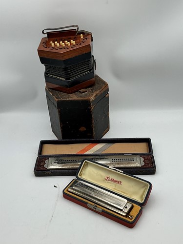 Lot 140 - A Lachenal 21 key concertina, with worn outer...