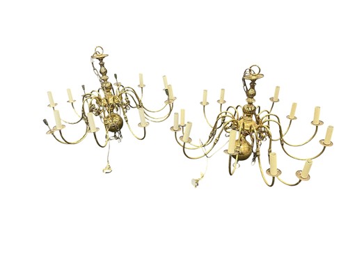 Lot 241 - A pair of Dutch style brass twelve light chandeliers, 20th century