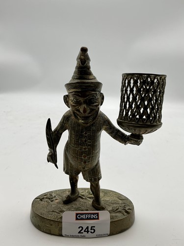 Lot 245 - A 19th century brass match holder in the form...