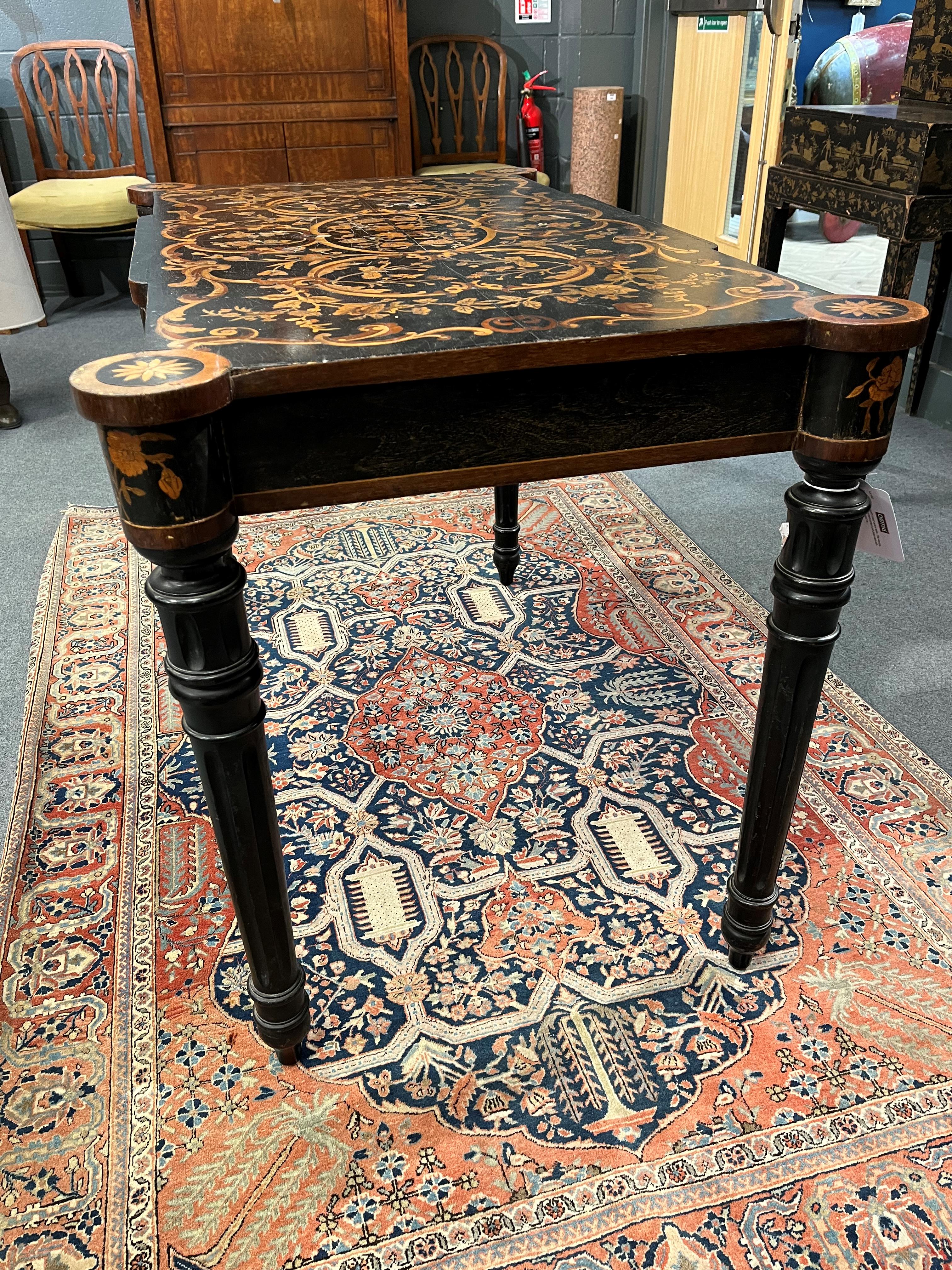 Lot 710 - An ebonised and marquetry inlaid centre