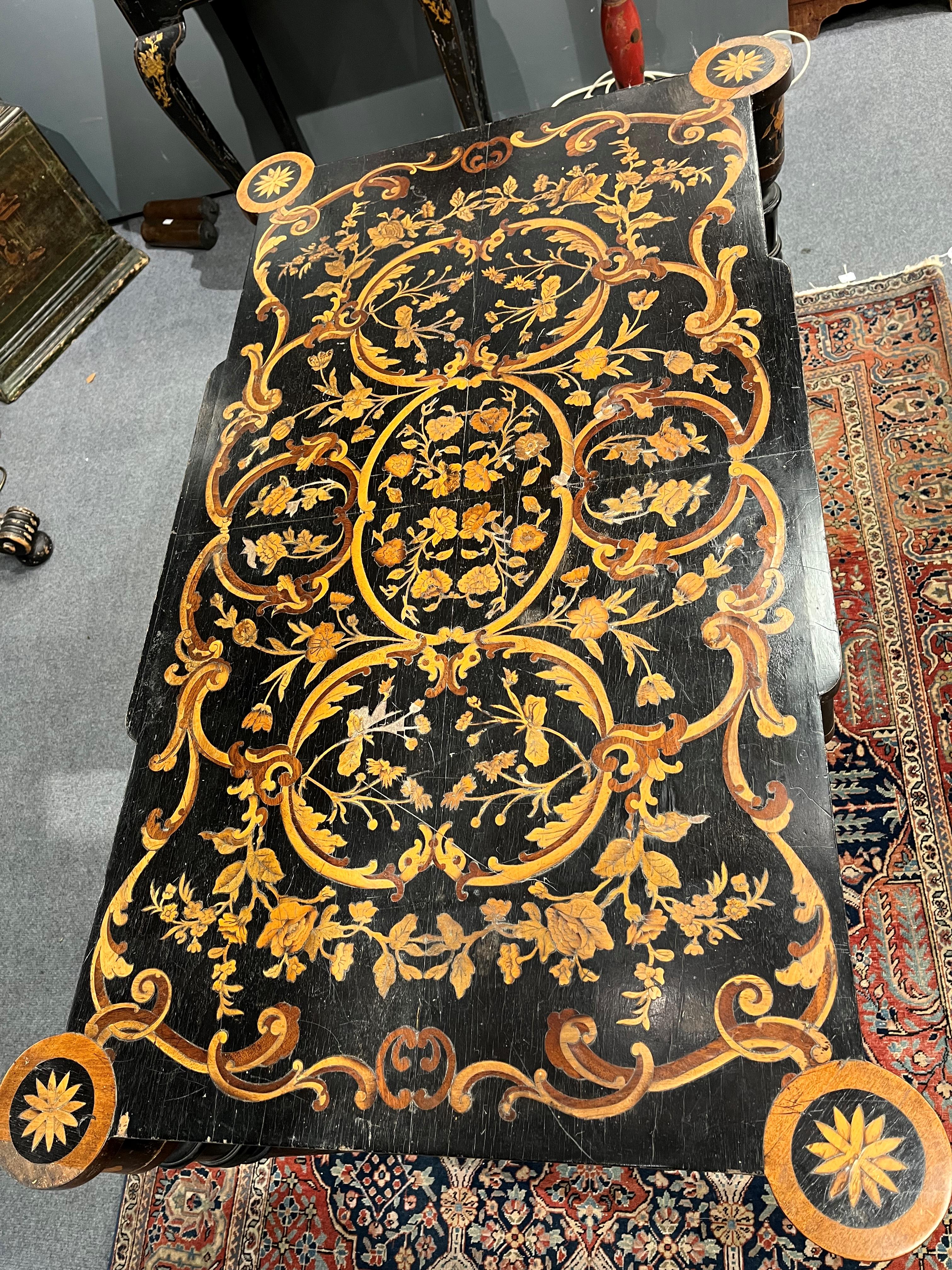 Lot 710 - An ebonised and marquetry inlaid centre