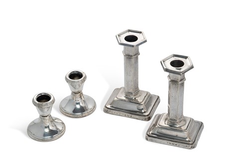 Lot 400 - A pair of George V silver column candlesticks