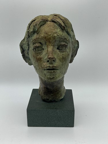 Lot 138 - A small bronze of a female head 19cm high total