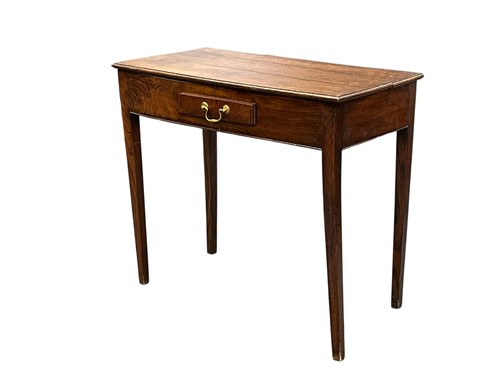 Lot 686 - A George III oak and elm side table