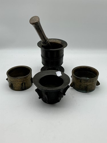 Lot 145 - Three bronze flanged mortars, a footed mortar,...