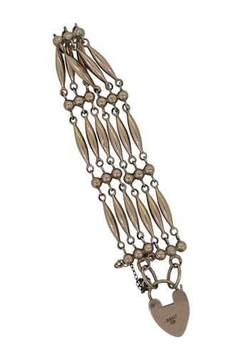 Lot 93 - A gate style padlock bracelet, torpedo style...