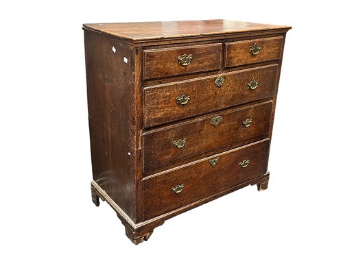Lot 613 - A George III oak chest of drawers