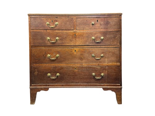 Lot 575 - A George III oak chest of drawers