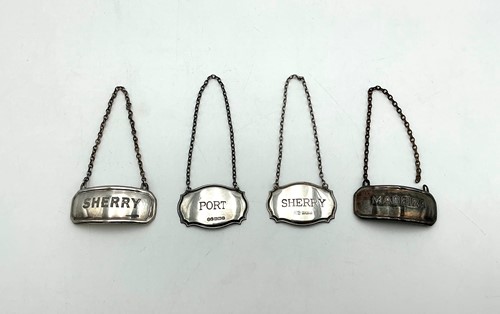 Lot 22 - Two pairs of silver bottle labels