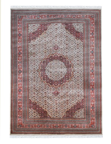 Lot 630 - A large Indian wool carpet, late 20th century
