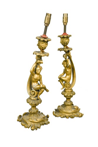 Lot 604 - A pair of gilt-bronze Rococo revival candlesticks, 19th century