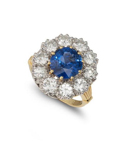 Lot 218 - A mid 20th century Burmese sapphire and diamond cluster ring